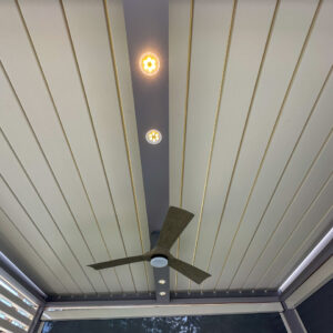 Close-up of accessory bar in custom pergola with lights and custom fan